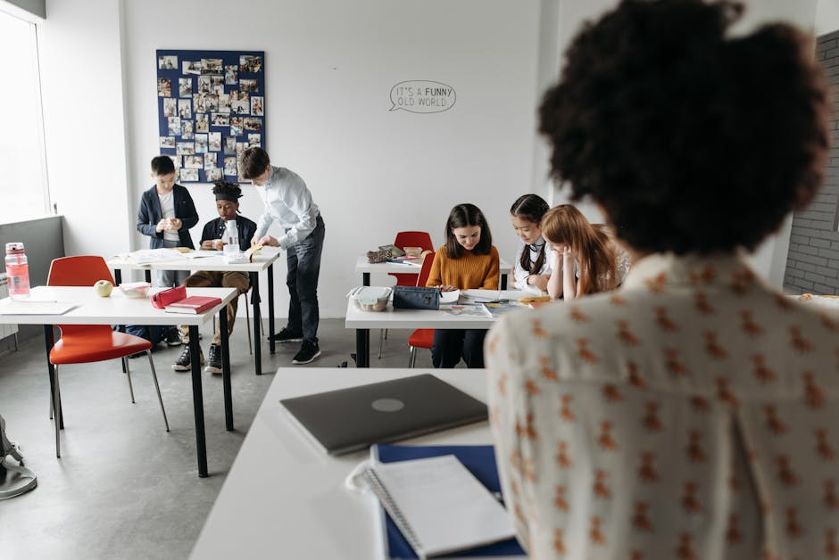Students focused in a modern classroom with diverse activities and interactions